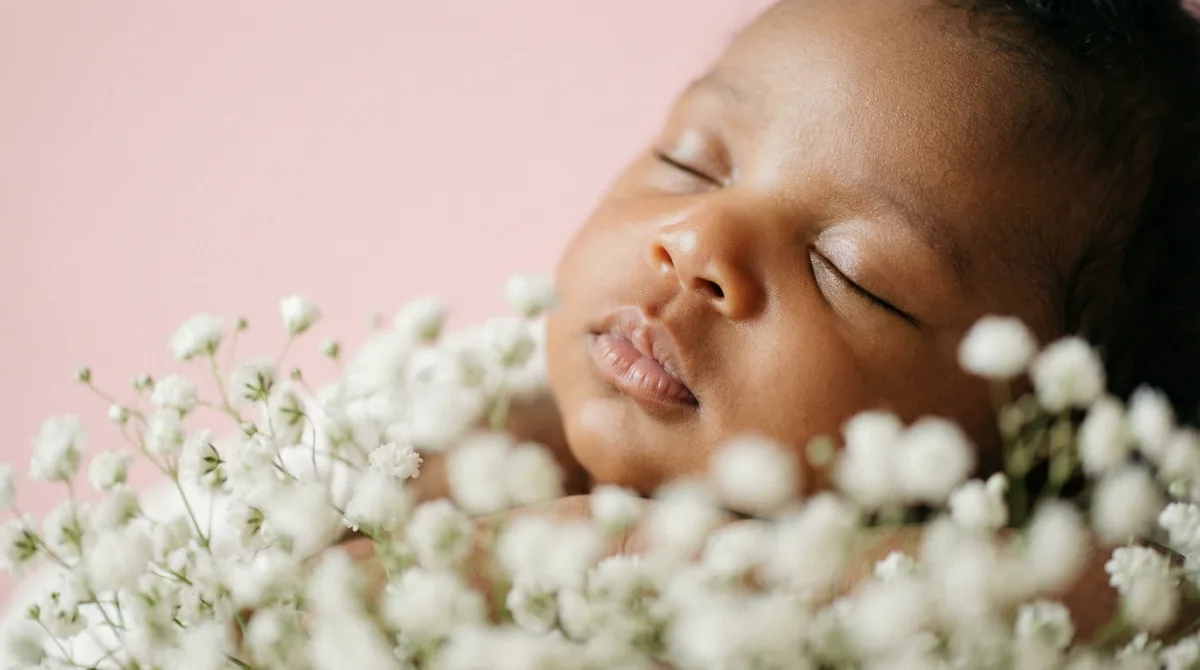 Artistic close-up of newborn baby with close up lips breath cluster