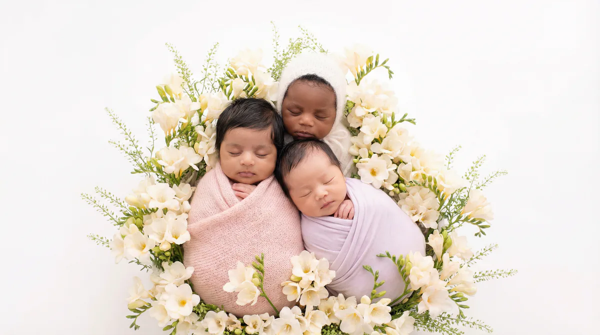 Diverse multicultural newborns in editorial fashion photoshoot with three newborns