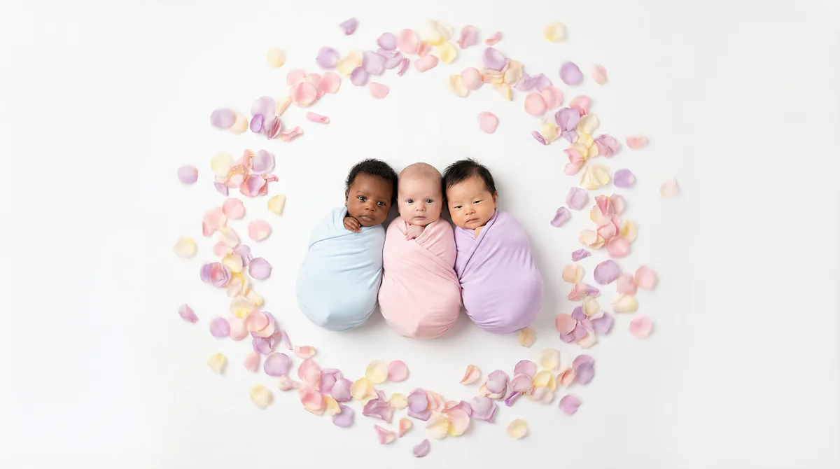 Diverse multicultural newborns in editorial fashion photoshoot with three newborns