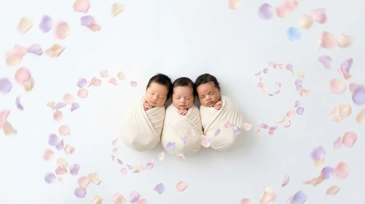 Diverse multicultural newborns in editorial fashion photoshoot with three newborns