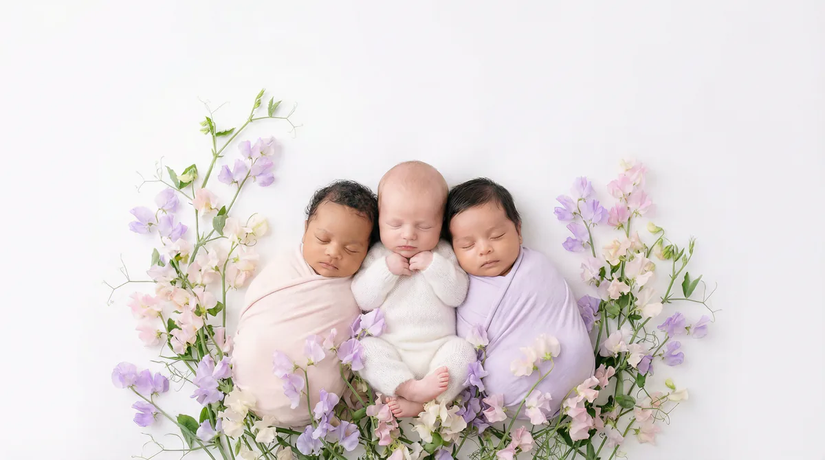 Diverse multicultural newborns in editorial fashion photoshoot with three newborns