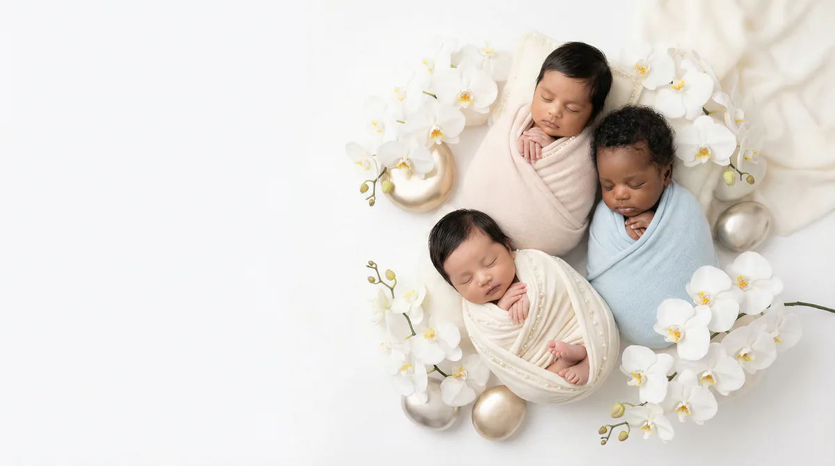 Diverse multicultural newborns in editorial fashion photoshoot with three newborns