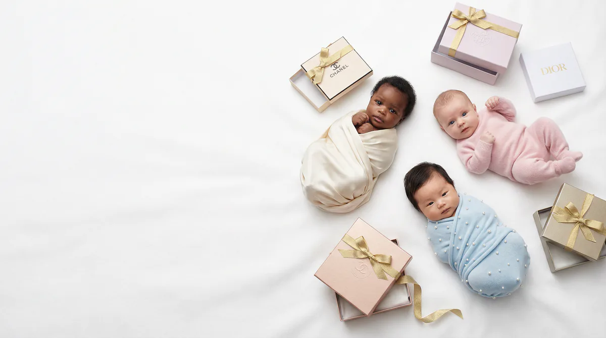 Diverse multicultural newborns in editorial fashion photoshoot with three newborns