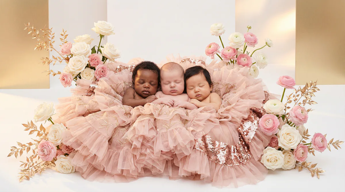 Diverse multicultural newborns in editorial fashion photoshoot with three newborns